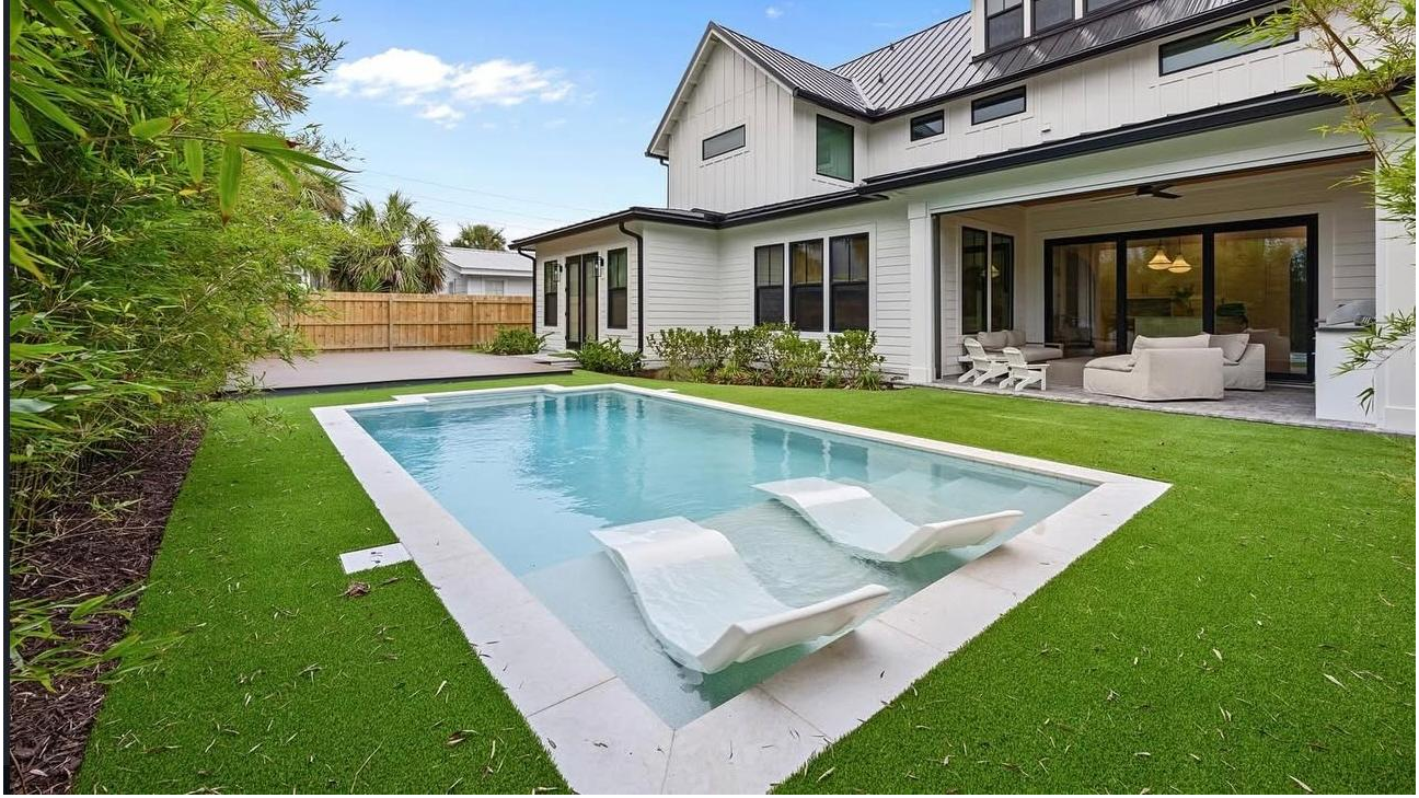 Premium backyard turf surrounding modern pool and patio